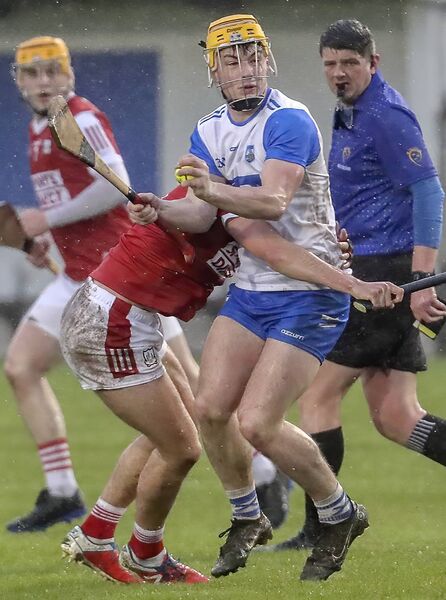 Waterford's Cillian Ryan is tackled by Cork's Eoin O’Leary. Waterford's Cillian Ryan is tackled by Cork's Eoin O’Leary.