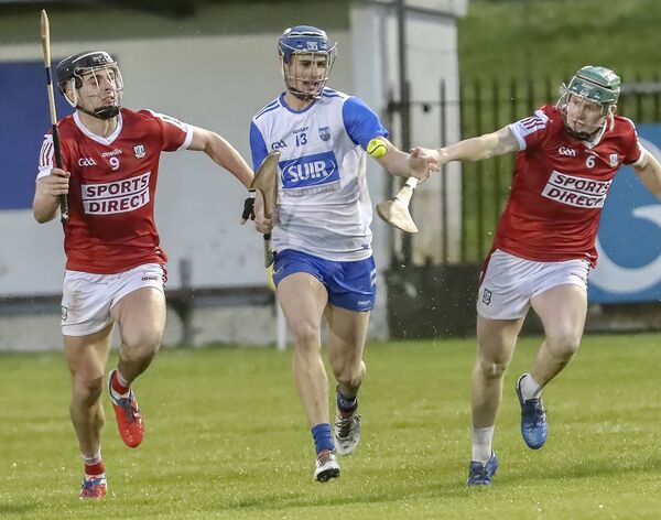 Waterford's Jack Twomey about to gain possession against Cork's Ben Walsh and Oran O’Regan. Waterford's Jack Twomey about to gain possession against Cork's Ben Walsh and Oran O’Regan.