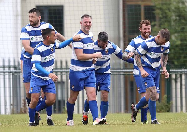 St. Joseph’s Daryl Murphy is surrounded by his team mates after scoring the winning goal. St. Joseph’s Daryl Murphy is surrounded by his team mates after scoring the winning goal.