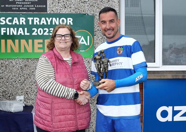 Louise Stafford presents the Man of the Match award to St. Joseph’s Paul Butler. Louise Stafford presents the Man of the Match award to St. Joseph’s Paul Butler.