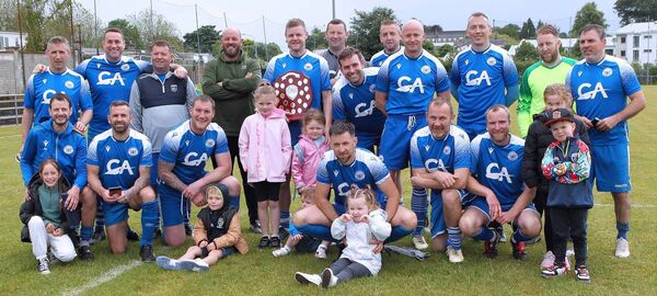 Dungarvan United celebrate after they were presented with the trophy for winning this year's Div.4 league. Dungarvan United celebrate after they were presented with the trophy for winning this year's Div.4 league.