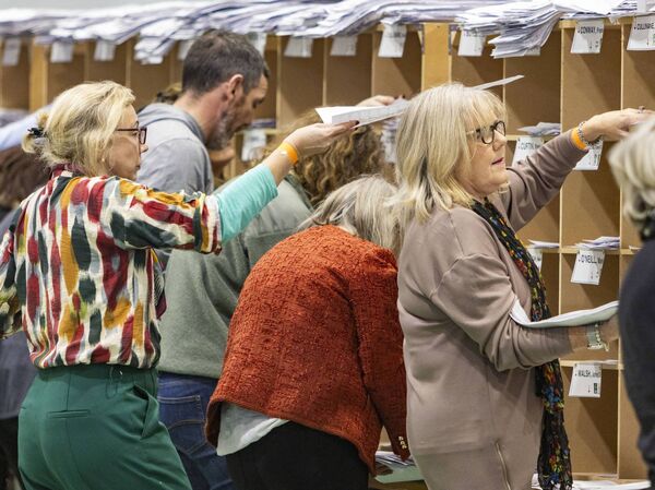 Busy sorting out the ballot papers. Photo: Joe Evans Busy sorting out the ballot papers. Photo: Joe Evans