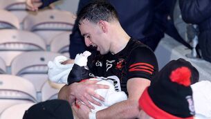 <p>While the cup was being presented what caught my eye was Man of the Match Dessie Hutchinson went to get his new born baby in the stand. Photos: Noel Browne</p> <p>While the cup was being presented what caught my eye was Man of the Match Dessie Hutchinson went to get his new born baby in the stand. Photos: Noel Browne</p>