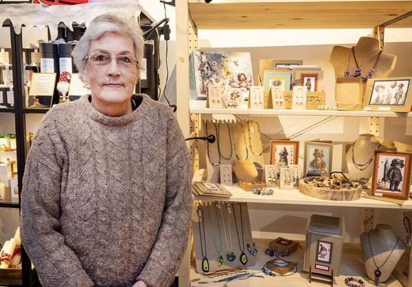 Liz Weston captured beside her daughter's mixed media artwork collection at the Christmas Craft Fare. Photo: Joe Evans Liz Weston captured beside her daughter's mixed media artwork collection at the Christmas Craft Fare. Photo: Joe Evans