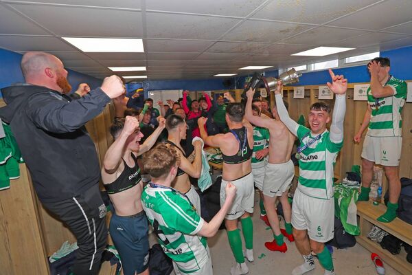 Villa captain Luke Walsh raises the cup in the dressing room as his side celebrate a first ever Munster Junior Cup success. Villa captain Luke Walsh raises the cup in the dressing room as his side celebrate a first ever Munster Junior Cup success.